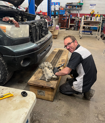 Mechanic in a shop working with tools